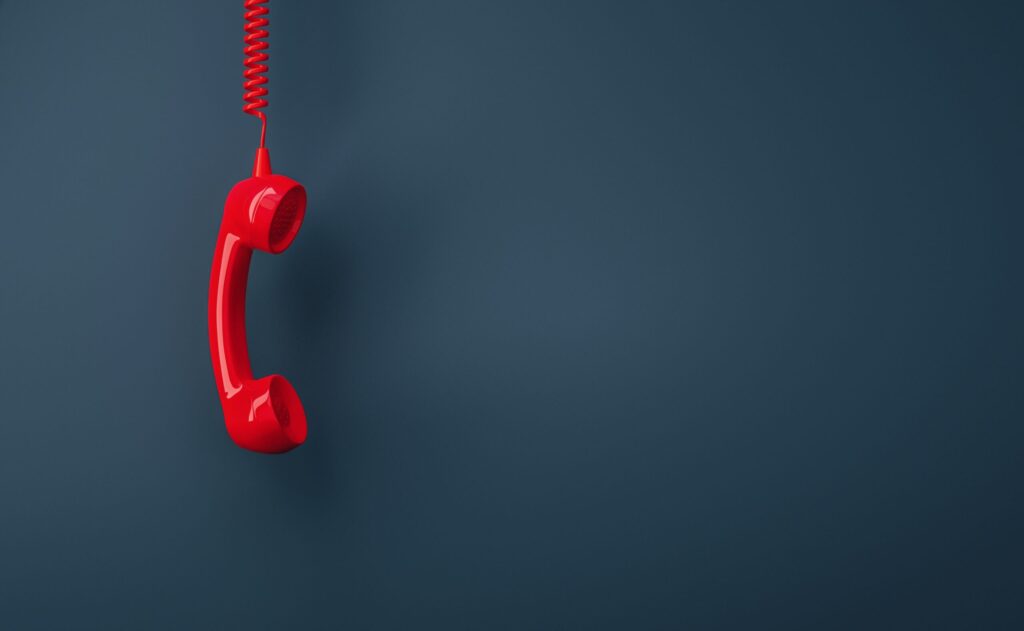 red phone on gray background