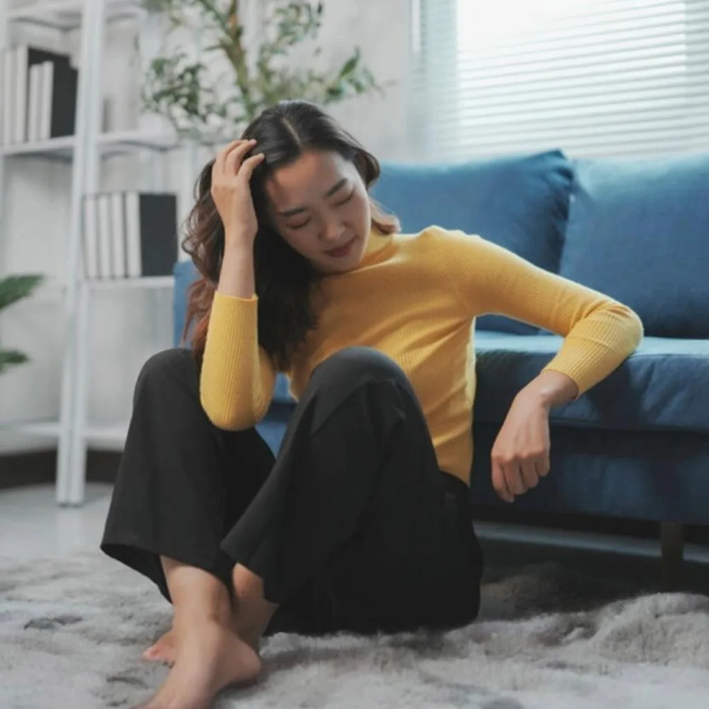 A young woman feeling concerned about her health